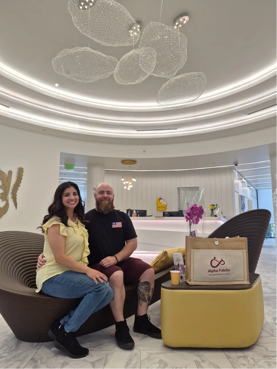 Couple seated together during a surrogacy consultation.