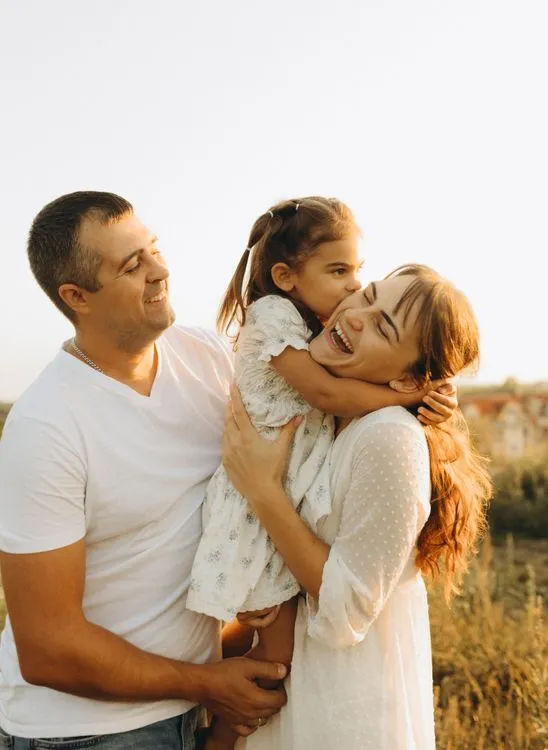 Happy family of three enjoying time together.