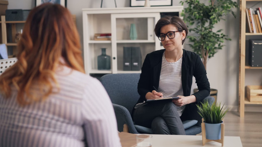 A woman meeting with a surrogacy coordinator during an initial consultation.