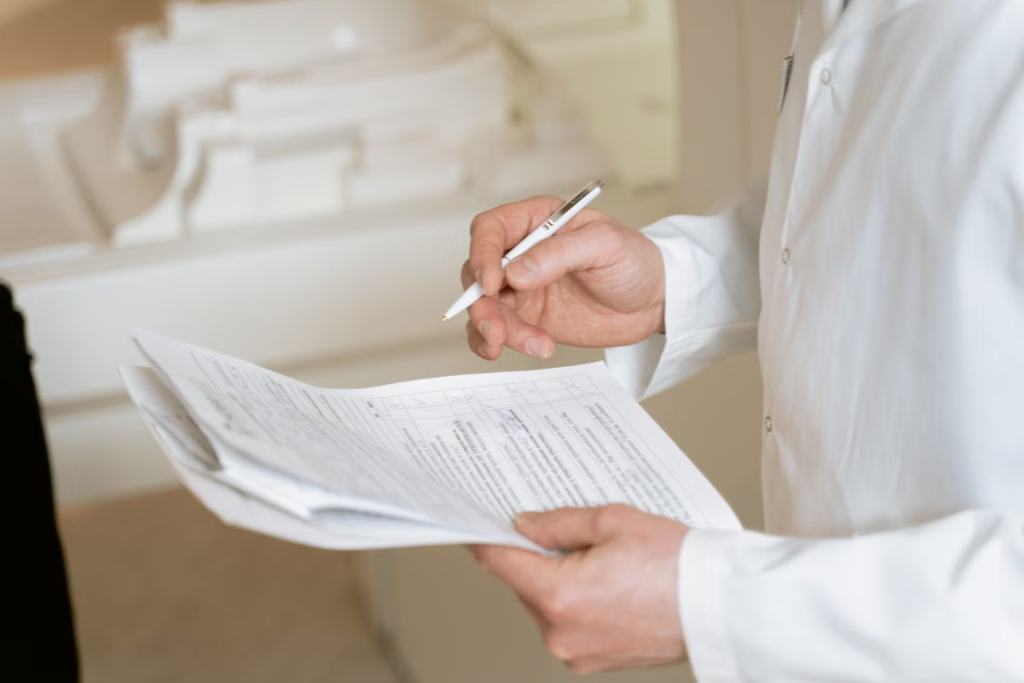 A healthcare professional reviewing medical records with a prospective gestational surrogate.