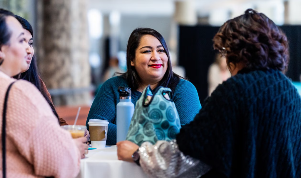 Surrogate and intended parents sharing a positive conversation with a case coordinator
