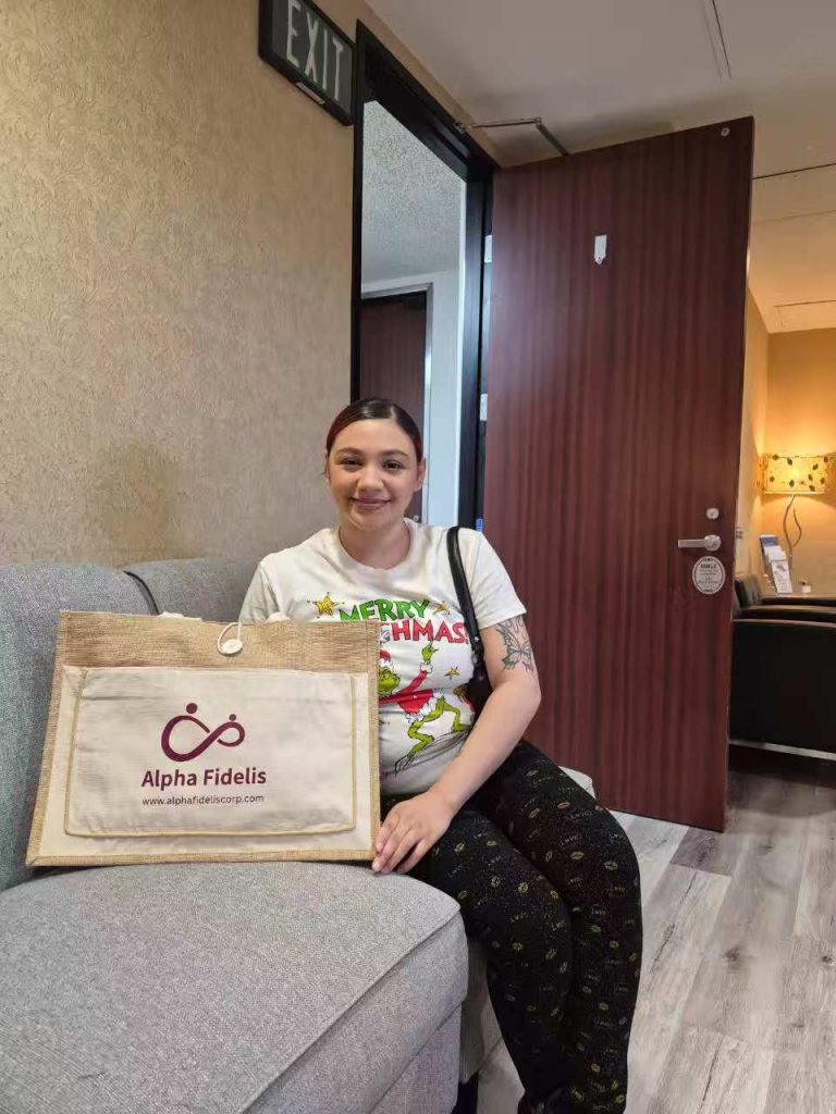 A person on a couch with a bag